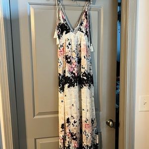Floral sweetheart neck dress. Ties at the shoulder. White multi colored flowers